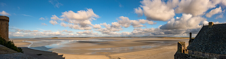 Fototapeta na wymiar Panoramic view of quicksand on the coast from Abbey Mont Saint Michel stone wall. Normandy, France