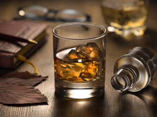 Backlit glass of whisky on the rocks
