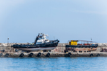 Old rusty ships-veterans on the last storage on the pier in Yalta, Crimea