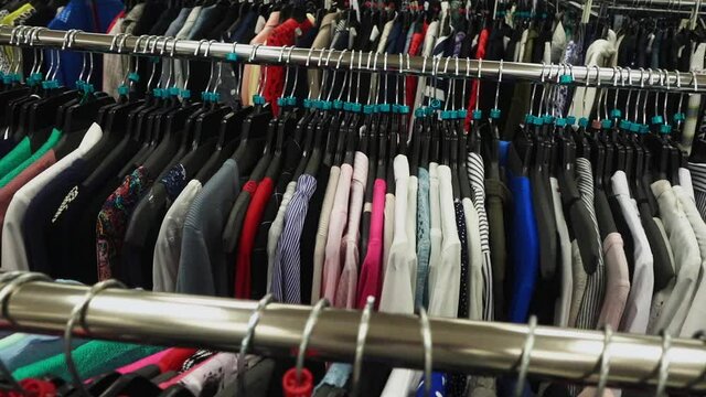 Slow Motion Through Racks of Different Clothing Closeup