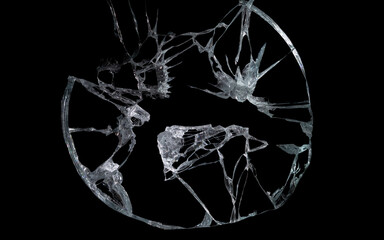 broken mirror and glass from impact on a black background in cracks in the form of an isolated abstraction