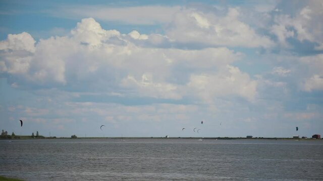 Horizon with Many Kite Surfers in Background.