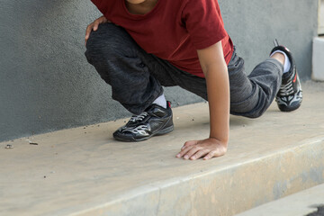 Young asian boy work out in outdoor. Active kids. Self care and health care concept.