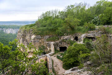 Houses built in caves in the famous ancient city-fortress Chufut-Kale ("Jewish Fortress" in Turkish) built in 5th - 6th century in the Crimean Mountains, now lies in ruins