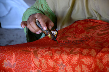 Painting traditional written batik in Sumenep, Madura, East Java, Indonesia
