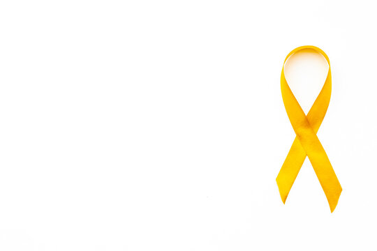 Yellow Cancer Awareness Ribbon Isolated On A White Background. Top View