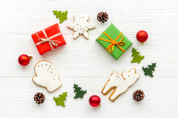 Gift boxes for Christmas with icing gingerbread cookies, top view