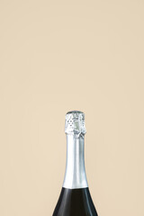 Neck of a champagne bottle with silver foil close-up. The concept of a celebration, holiday, new...