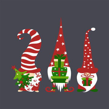 Three cute scandivaian christmas gnomes holding gift boxes and tree on dark grey background.
