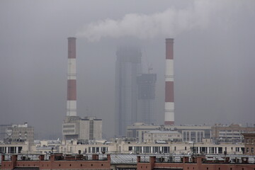 Fototapeta na wymiar Thermal power plant pipes in he city