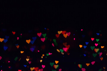 Bokeh lights background. Stars bokeh defocused background. Holiday background. Garland. Defocused blinks. New Year. Bokeh retro style photo.