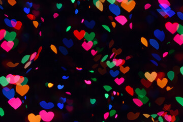 Bokeh lights background. Stars bokeh defocused background. Holiday background. Garland. Defocused blinks. New Year. Bokeh retro style photo.