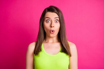 Portrait of shocked pretty brunette long straight hair young lady wear lime top isolated on bright pink background