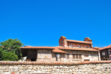 Old ruined stone house by blue sky