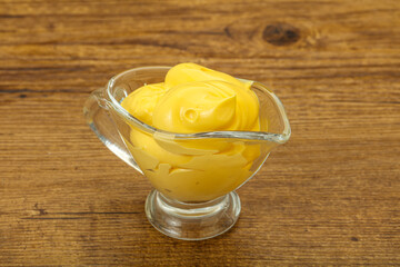 Natural cheese sauce in the bowl