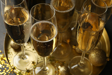 Tray with champagne glasses and glitter, close up