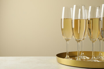 Tray with glasses of champagne, space for text