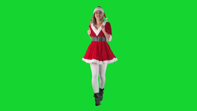 Late Christmas Santa Claus girl running in panic expression hurry and looking at camera. Full body length on green screen background. 