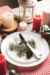Concept of New year table setting with candles on gray table
