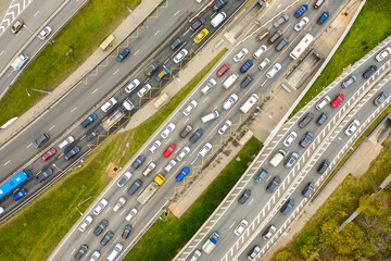 Aerial drone view of highway with busy urban traffic in modern city. Traffic jam from above