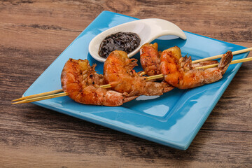 Grilled prawn skewer with pepper sauce