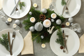 Concept of romantic New year table setting on gray table
