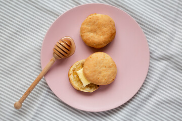 Homemade Flaky Buttermilk Biscuits on a pink plate, top view. Flat lay, overhead, from above.