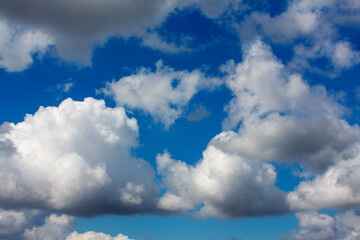 White clouds cumulus floating on blue sky for backgrounds concept