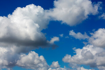 White clouds cumulus floating on blue sky for backgrounds concept