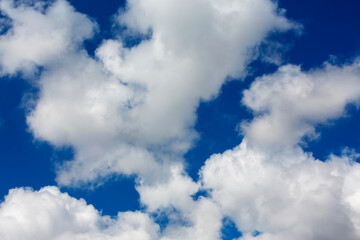 White clouds cumulus floating on blue sky for backgrounds concept
