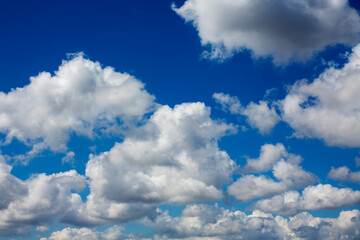 White clouds cumulus floating on blue sky for backgrounds concept