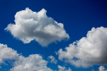 White clouds cumulus floating on blue sky for backgrounds concept