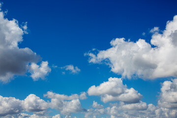 White clouds cumulus floating on blue sky for backgrounds concept