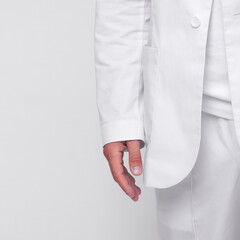 close-up hand male doctor in white medical costume which is standing straight on the white wall background. medical concept. free space , mockup