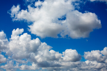 White clouds cumulus floating on blue sky for backgrounds concept