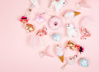 Flamingo and sweets baubles on pastel pink background