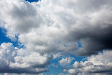 White clouds cumulus floating on blue sky for backgrounds concept
