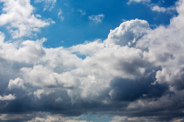 White clouds cumulus floating on blue sky for backgrounds concept