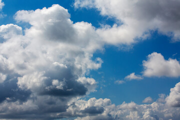 Fototapeta na wymiar White clouds cumulus floating on blue sky for backgrounds concept