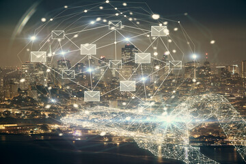 Double exposure of envelop hologram flying from gadget and city view background. Concept e-mail.