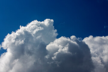 White clouds cumulus floating on blue sky for backgrounds concept