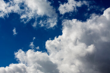 White clouds cumulus floating on blue sky for backgrounds concept