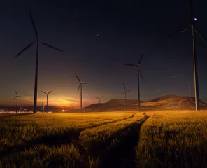 Fotobehang Beautiful sunset field with wind mill generators. big city in background © Anna Stakhiv