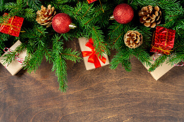 Christmas background with fir branches.Christmas background. Red ornaments on spruce branches. Christmas Flatley. Top view from copyspace