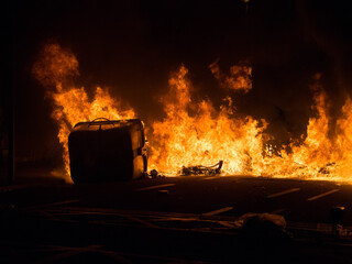 Garbage containers burn in a Barcelona Street after violence demonstration in support of...