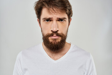 Obraz premium emotional bearded man close-up facial expression studio lifestyle