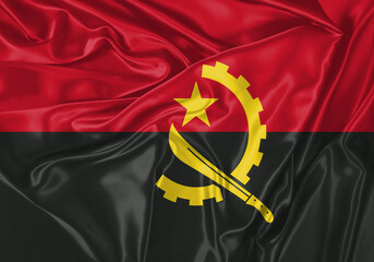 Angola flag waving in the wind. National flag on satin cloth surface texture. Background for...