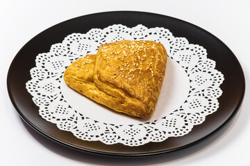 Rissole with chicken chopped meat on a black plate