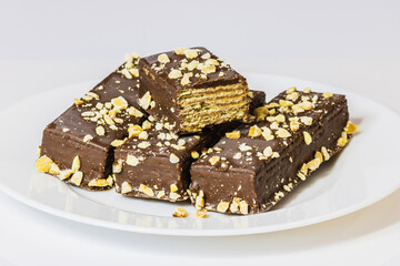 Biscuit with chocolate and pine nuts оn white