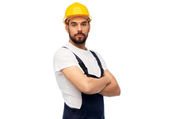 profession, construction and building - male worker or builder in yellow helmet and overall with...